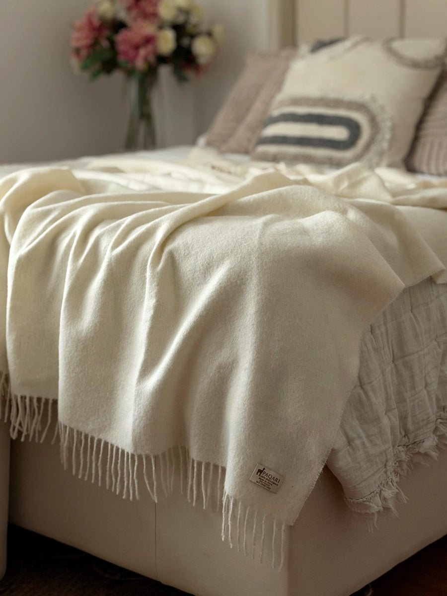 The Throw in Natural, undyed cream baby alpaca